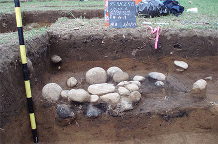 stones from a hearth in archaeological dig site 
