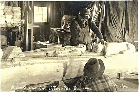 Historical photograph showing William Shelton carving a pole in Tulalip.