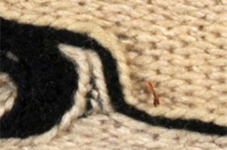 A close up view of a woven segment of the Chilkat Dancing Blanket 