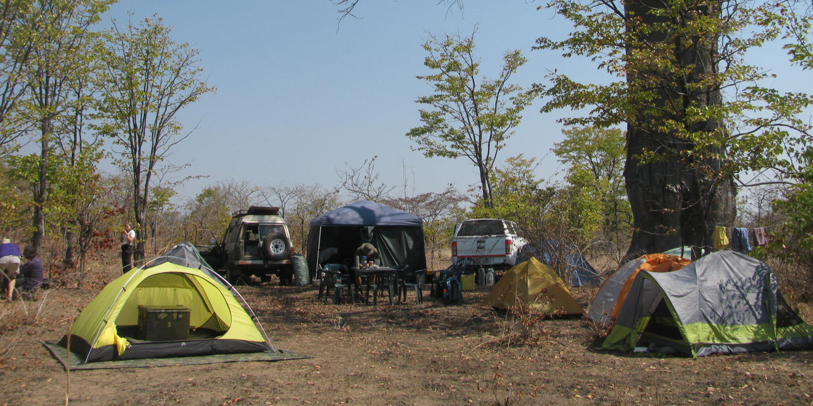 Tents and vehicles on flat terrain