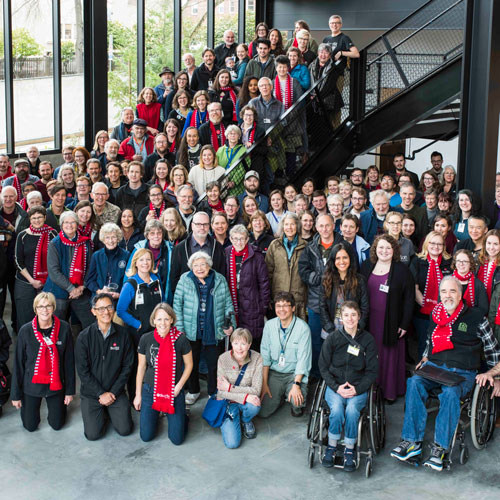 staff and volunteers line the stairs of the new burke