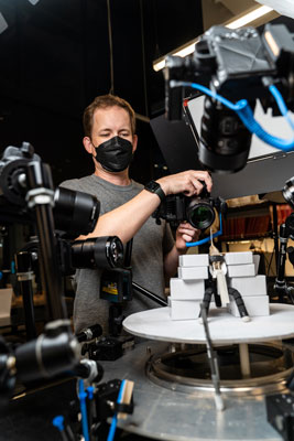 kevin epperly takes photos of a hummingbird specimen