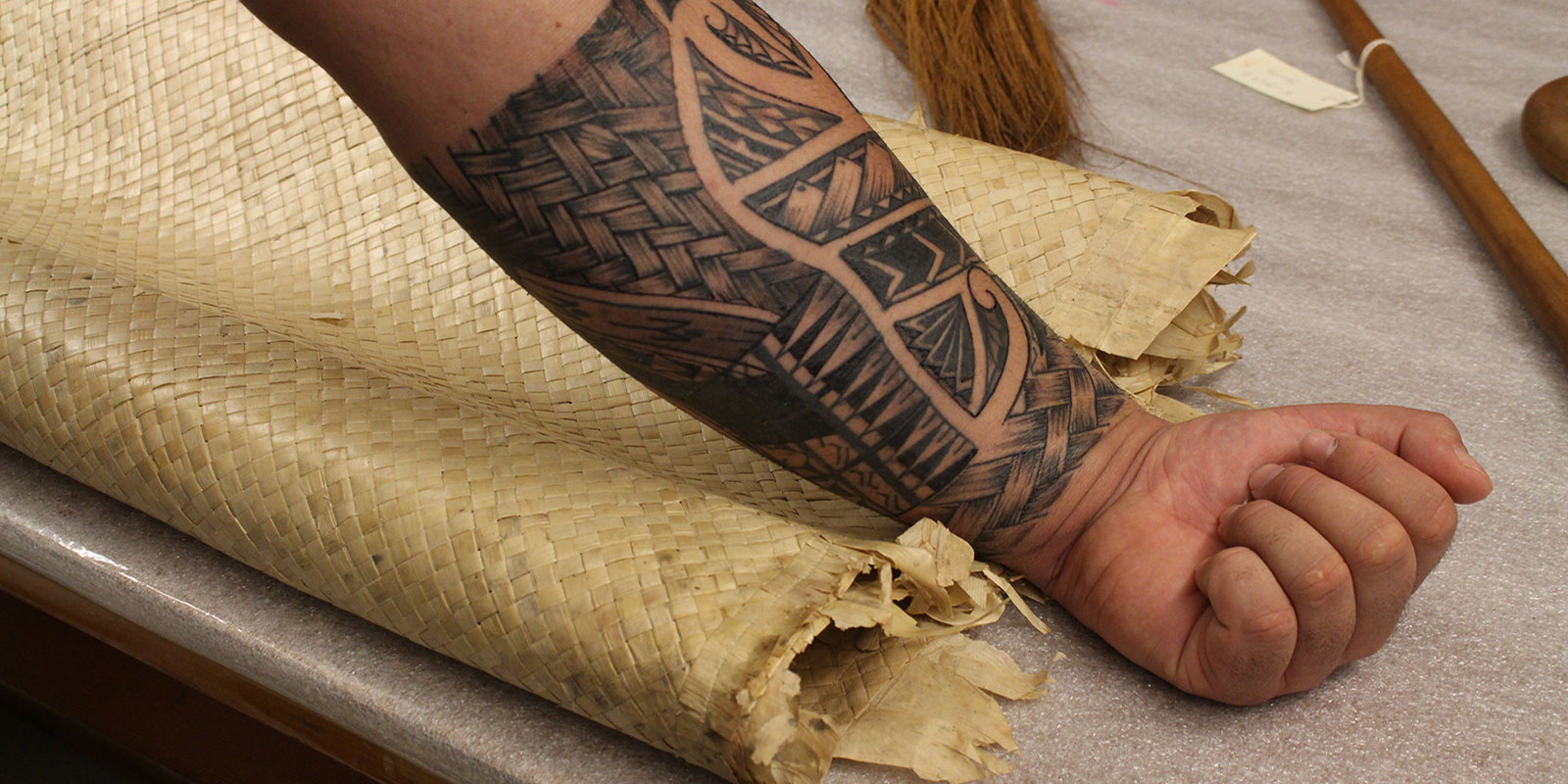 Close up of Fuavai's tattooed forearm