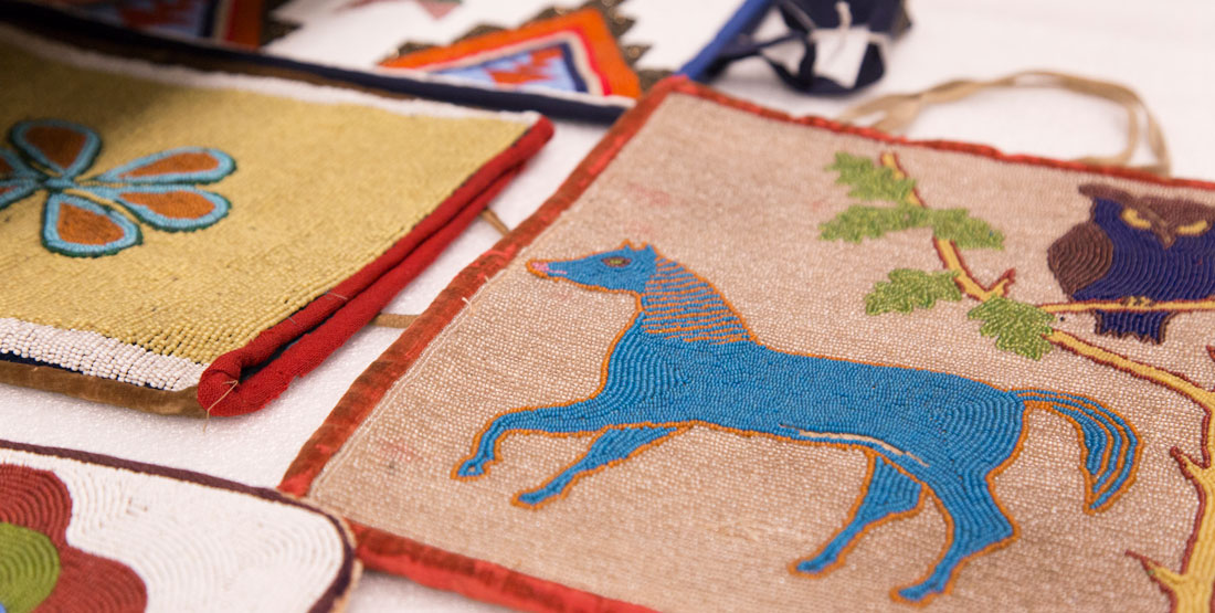 close up of beaded bags in a drawer in the collection