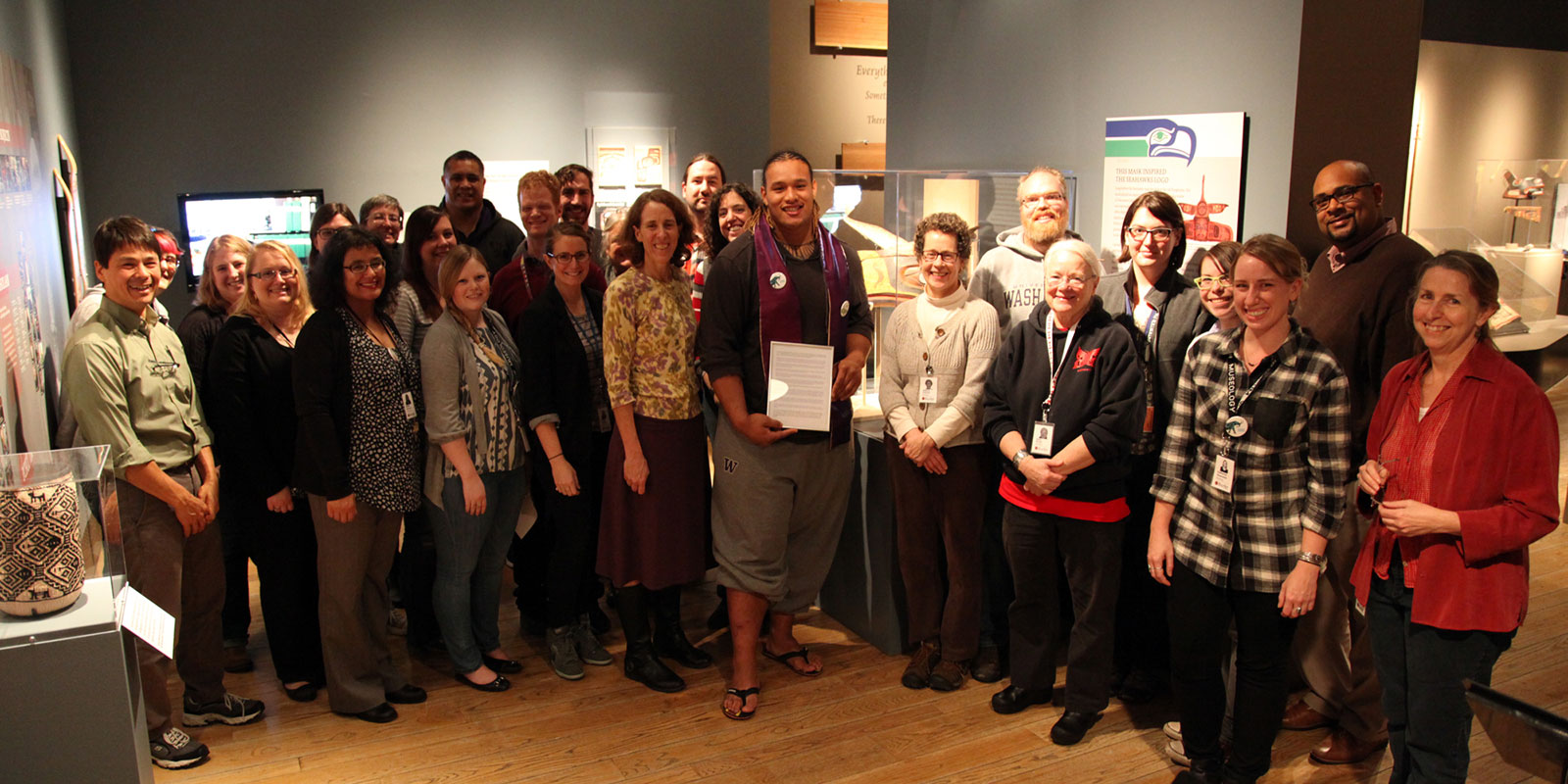 a large group of Burke Museum staff stand with Danny