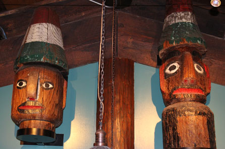 A comparison photo between two totem pole styles