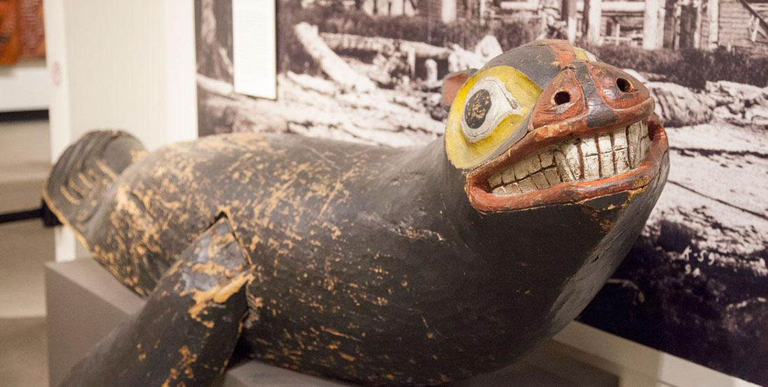 A wooden native art sealion carving