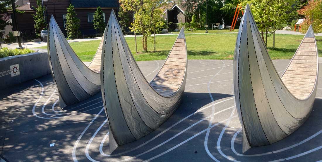 metal and wood benches that look like tatalas in christie park in seattle