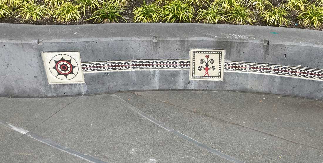 tao symbols on a cement wall in Christie Park