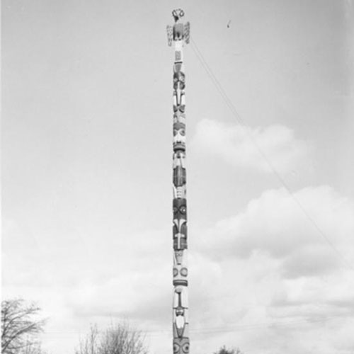 black and white photograph of a totem erected in tacoma