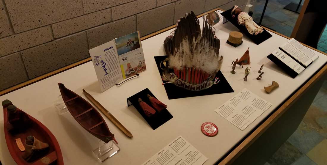 a table featuring items depicting Native American stereotypes