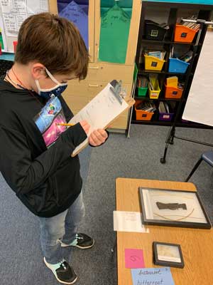 student interacts with burke box