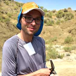 portrait of zack shinkle in the field