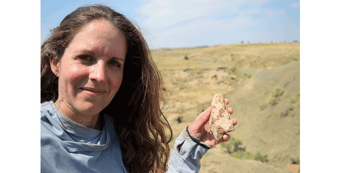 A DIG participant shows off fossilized bone from a project site.