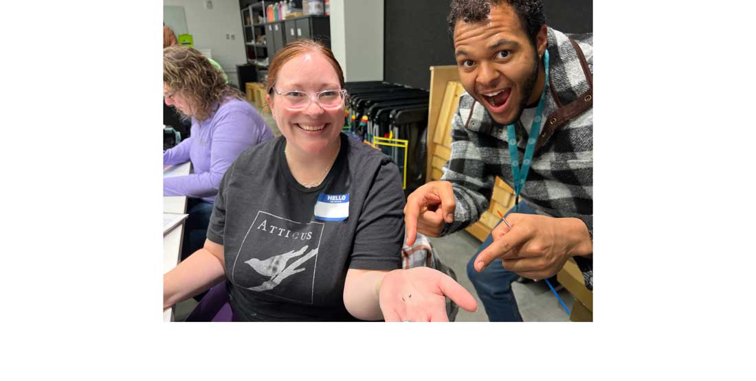 participant shows off tiny mammal teeth found while sorting microfossils