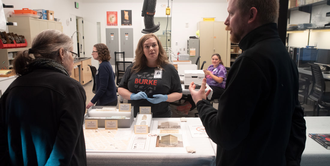 visitors speak with a staff member