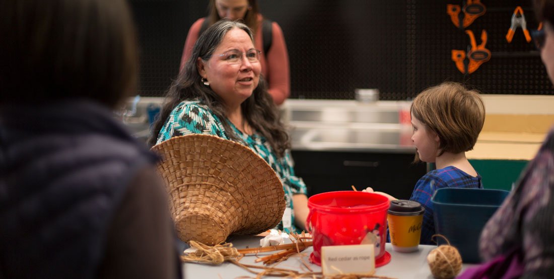 lisa telford interacts with visitors during the grand opening of the new burke museum