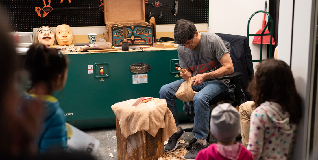 david boxley carves wood in the artist studio