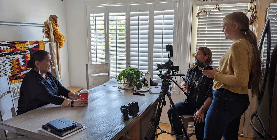 film crew films an interview