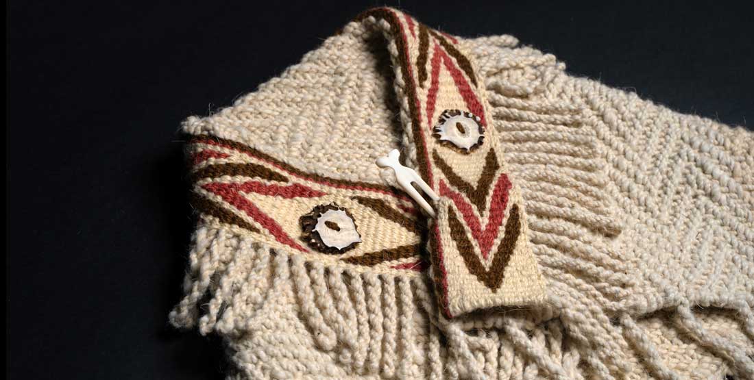 Many Hands, overspun shawl, 2025. Haʔməkwitən Kelly Sullivan (Port Gamble S’Klallam). Mountain goat wool, alder cones, red cortinarius mushroom, deer bone, and antler.  