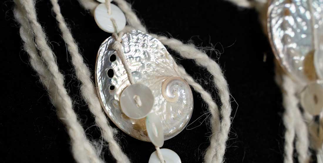 Sacred Wealth, necklace (detail), 2025. Chepximiya Siyam Chief Dr. Janice George (Squamish) mountain goat wool, shell.