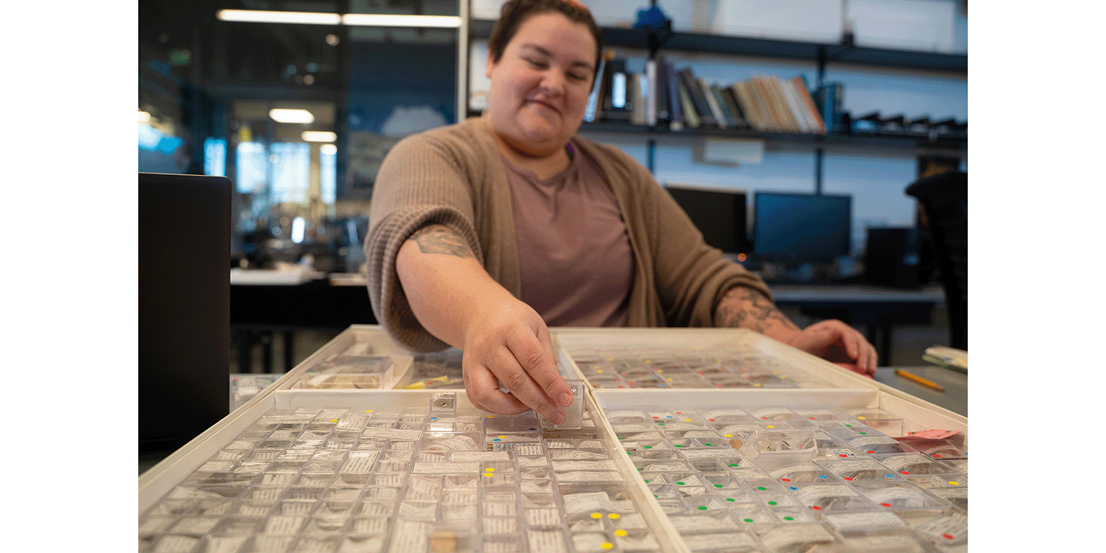 Deanna sorts through the Burke vertebrate paleontology collection  