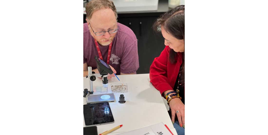 participants sort microfossils under a microscope