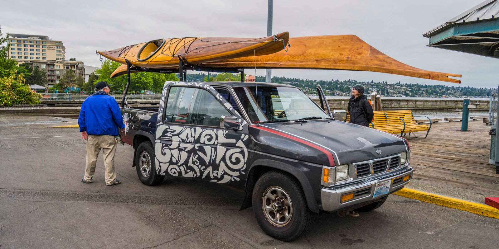 a kayak and the canoe on the top of a truck