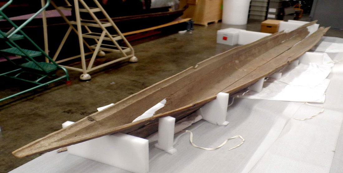 The canoe hull sits with the help of foam wedges in the Burke Museum collection