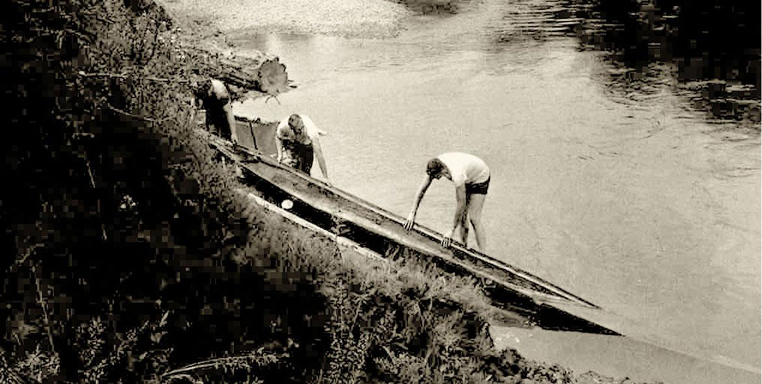 Historic photograph of the canoe being recovered from the Green River