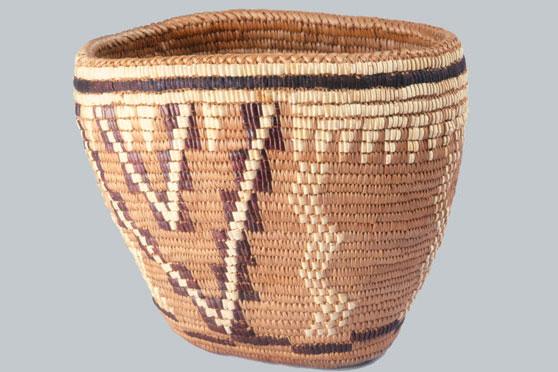 A woven basket depicting a Mountain, Lightning and Icicle basket in the Coast Salish style