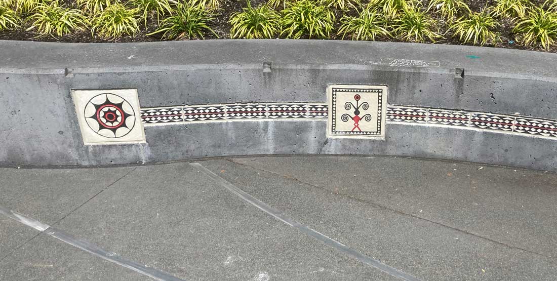 a park wall with tao symbols on it