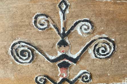 a magamaog symbol carved into a tatala
