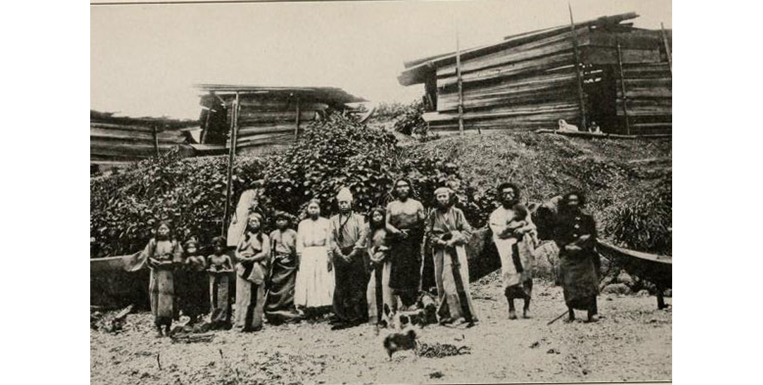 A historic photo taken in 1873 of Coast Salish community members and woolly dogs. 