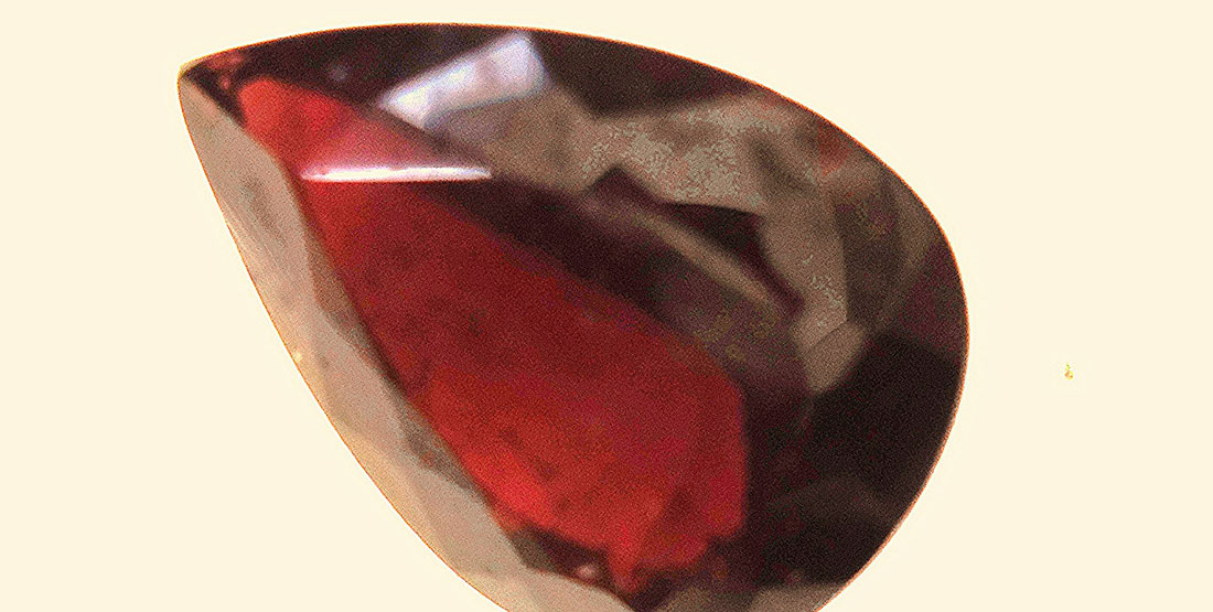 close up of cut and polished red garnet