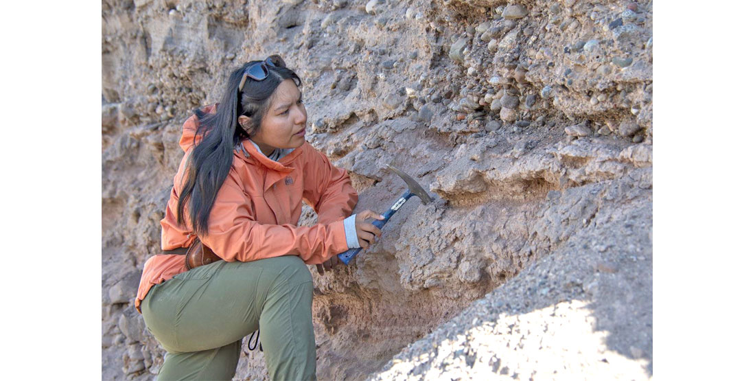 U of A doctoral student Priscilla Martinez conducting fieldwork in an ancient dry riverbed where minerals were found proving that standard, temperate-climate plants once covered the now-arid Chilean coast. 