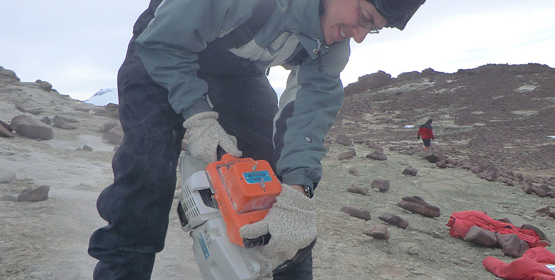 A man uses a rock saw