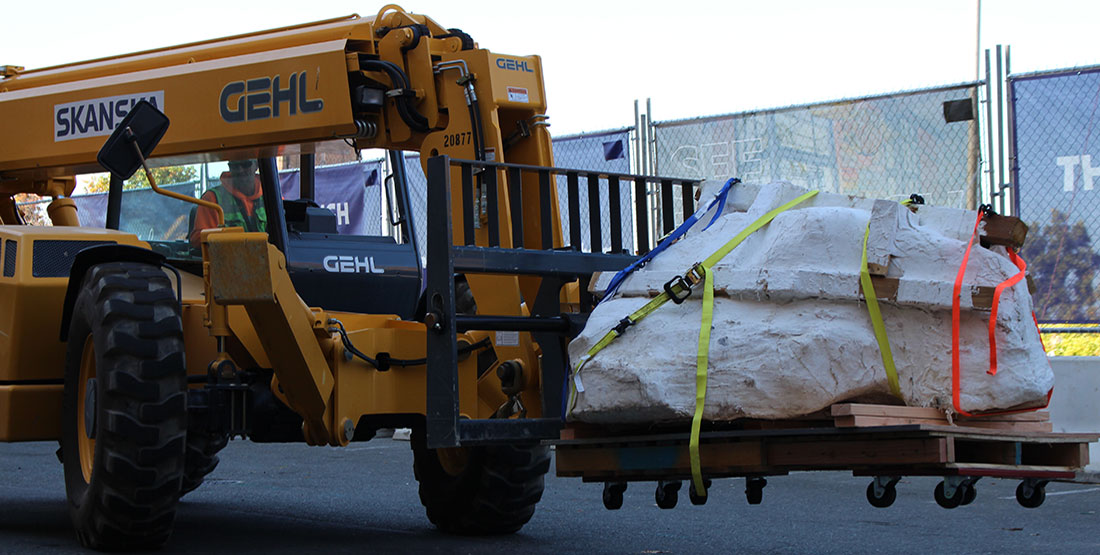 The skull jacket is lifted by a Skanska construction vehicle