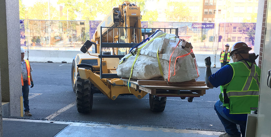 The skull jacket is loaded into the Burke Museum loading dock