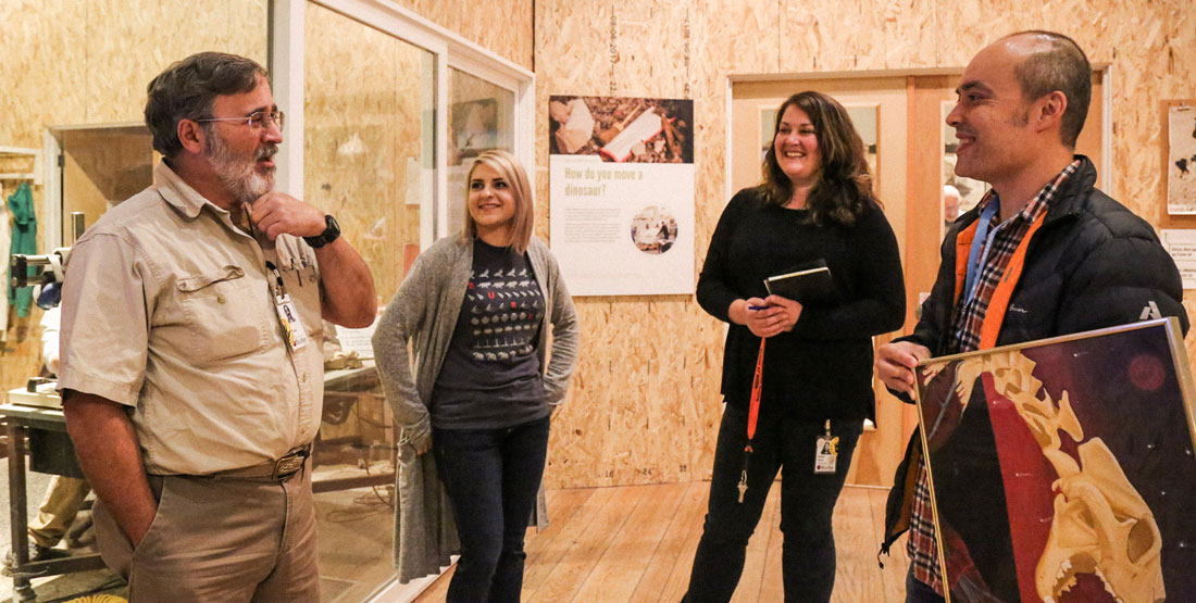 two men and two women stand in the burke paleontology prep lab