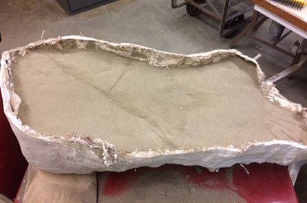 The sandstone inside of the plaster cast that held the T. rex jaw