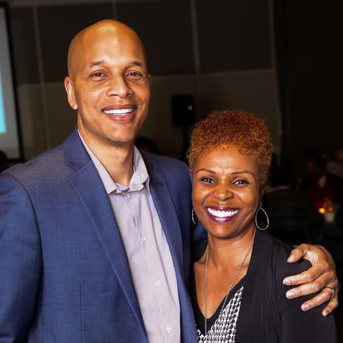 a man and woman pose for a photo at a previous gala