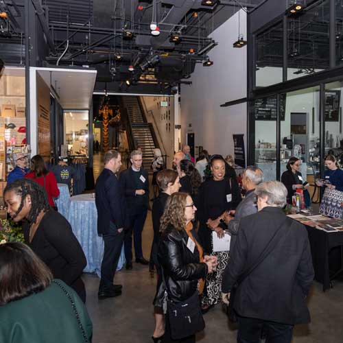 guests at an event in the main lobby of the burke museum