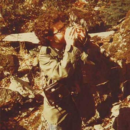 rod crawford examines a spider in March 1973