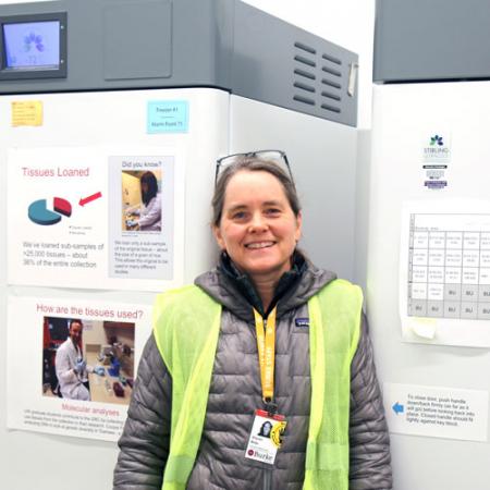 a woman stands next to the first two freezers moved over