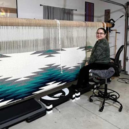 Danielle Morsette weaves at her loom