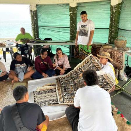 regina fitiao share artwork with a group of adults