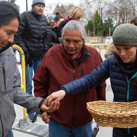 people gather at the camas planting ceremony at the burke museum, december 2019