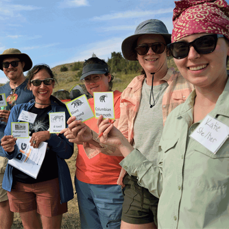 dig participants stand in a line during an activity