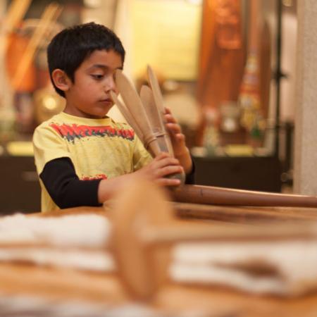 a student looks at an object
